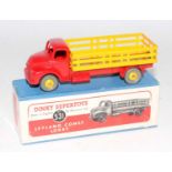 A Dinky Toys No. 531 Leyland Comet lorry comprising of red cab and chassis with yellow hubs and