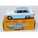 A Dinky Toys No. 189 Triumph Herald saloon comprising of light blue and white body and housed in the