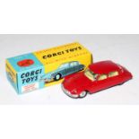 A Corgi Toys No. 210S Citroen DS19 comprising of darker red body, lemon interior and spun hubs, in