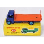 A Dinky Toys No. 433 guy flat truck comprising of a dark blue cab and chassis with light blue hubs