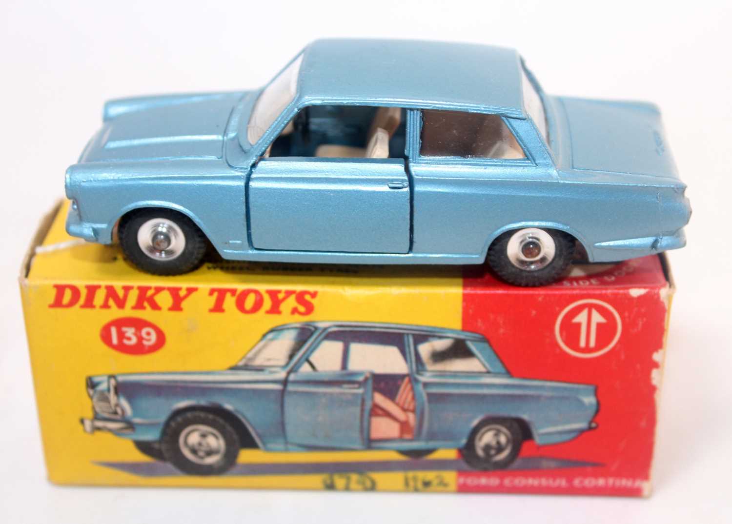 A Dinky Toys No. 139 Ford Console Cortina comprising metallic blue body with green interior and spun