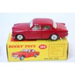 A Dinky Toys No. 184 Volvo 122S comprising of red body with cream interior and spun hubs, housed