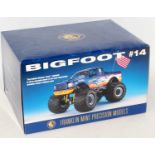 A Franklin Mint 1/24 scale diecast model of a Big Foot Monster Truck finished in metallic blue