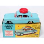 A Corgi Toys No. 236 Motor School Car comprising of blue body with silver side flash, red
