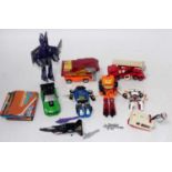 A collection of various original and later transformers, mixed examples to include fire engine,