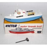 A Sutcliffe Models tinplate and clockwork model of a Victor Motor Torpedo speed boat, appears