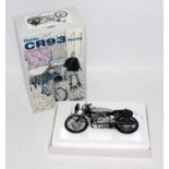 An Ebbro 1/10 scale model of a Honda CR93 racing motorcycle housed in the original pictorial