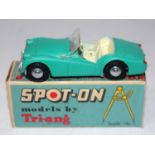 A Spot-On Models by Triang No. 108 Triumph TR3 saloon comprising of green body with cream