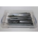 Plastic lidded tray containing nickel Meccano strips and girders (VG)
