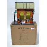 An ACE trains vintage style tin printed water tower ref AC/2, with instructions (M-BM)