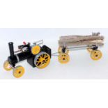 A Mamod small traction engine with yellow wheels and burner, appears unused, together with a
