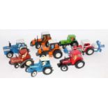 Eight various loose Britains farm tractors to include a Fiat 880 DT track type tractor, a Massey
