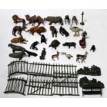 A collection of various Britains and similar lead hollow cast zoo animals and accessories to include