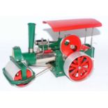 A Wilesco Old Smoky steam roller traction engine comprising of cream chrome and red body complete