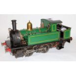A 7¼" gauge live steam locomotive finished green with polished boiler bands and half cab giving