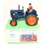 A Britains model farm series No. 128F Fordson Major tractor comprising of blue body with orange hubs