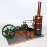 A fine model of a Stuart Turner Victoria Mill Engine mounted on wood and metal baseplate with copper