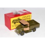 A Britains No. 1877 Beetle lorry comprising of military green and tan body with driver figure and