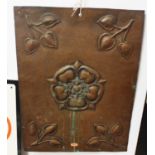 An early C20th hammered copper panel decorated with the Tudor Rose, 56cm x 40cm