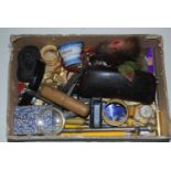 A box of miscellaneous items to include pens, corkscrew, bone etc