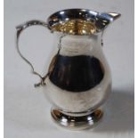 A modern silver cream jug, the plain undecorated form having C-scroll handle, 3.1oz