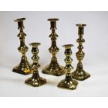 Two pairs of Victorian brass candlesticks, together with one single brass candlestick (5)