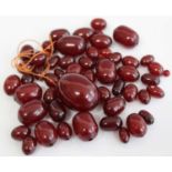 A faux cherry amber bead necklace, the graduated beads approx 2.3-0.6cm dia, gross weight 65g (beads