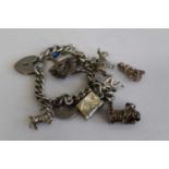 A silver curb link charm bracelet together with sundry loose charms, 43g