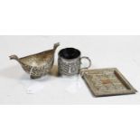 An early C20th Indian embossed silver lozenge tray and twin handled boat shaped sugar bowl and
