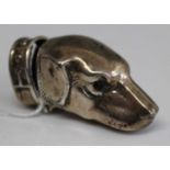 A modern white metal novelty vesta case in the form of a dog's head and having round cut garnet