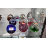 A collection of modern glass paperweights to include Caithness (10)