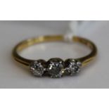 An 18ct gold diamond three-stone ring 1.9g size K/L