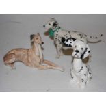 A Beswick Puppit Dalmatian, model No. 1002, together with a Country Artists resin figure, Best in