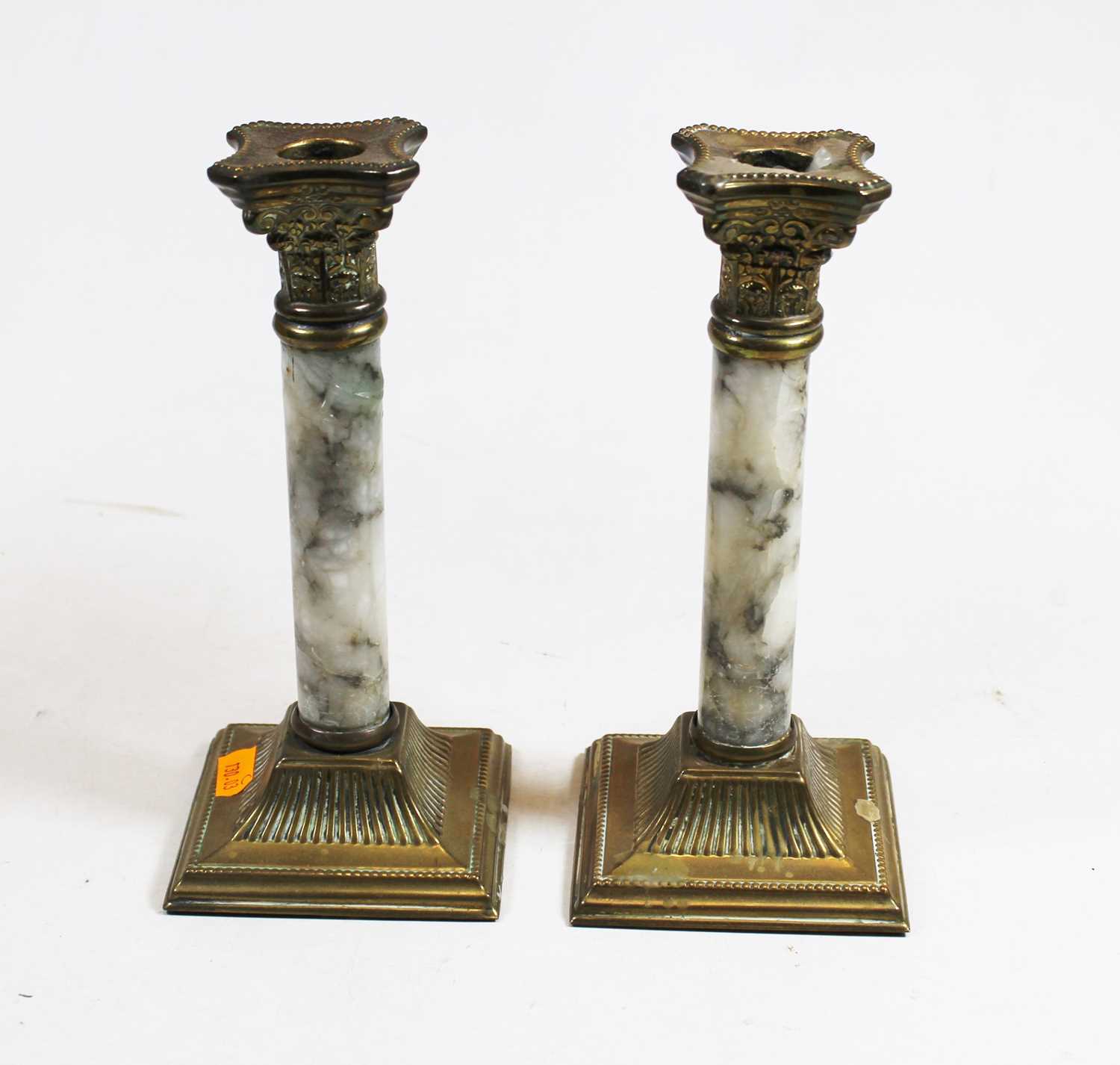 A pair of brass and veined marble candlesticks, in the form of Corinthian columns, each h.21cm