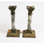 A pair of brass and veined marble candlesticks, in the form of Corinthian columns, each h.21cm