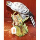 A German porcelain model of a bird of prey, with rabbit in talons, and on naturalistic base, h.
