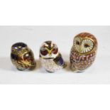 A Royal Crown Derby porcelain model of an owl, L1X, h.12cm; together with two other similar Royal