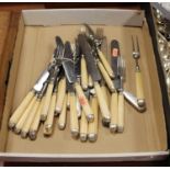 A collection of 19th century loose flatware, having ivory handles and white metal caps