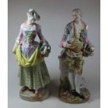 A pair of late C19th Dresden porcelain figures, each shown in traditional dress, each h.40cm (a/f)
