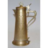 An Art Nouveau brass hot water pot, having stylized floral decoration and shaped handle, h.29cm