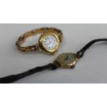 A ladies 18ct gold cased mechanical wrist watch having unsigned white enamel dial, manual wind