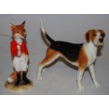 A John Beswick figure of a foxhound model No. JBD71, together with a Beswick figure 21st century fox