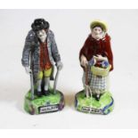 A pair of pearlware figures each titled 'Old Age' height 17cm