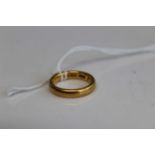 A 22ct gold wedding band, 6.3g, size J