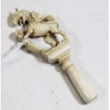 A 19th century carved ivory seal, in the form of a rampant griffin, 9cm