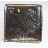 A WMF pewter square dish, relief decorated with a classical figure reclining, with Vetruvian wave