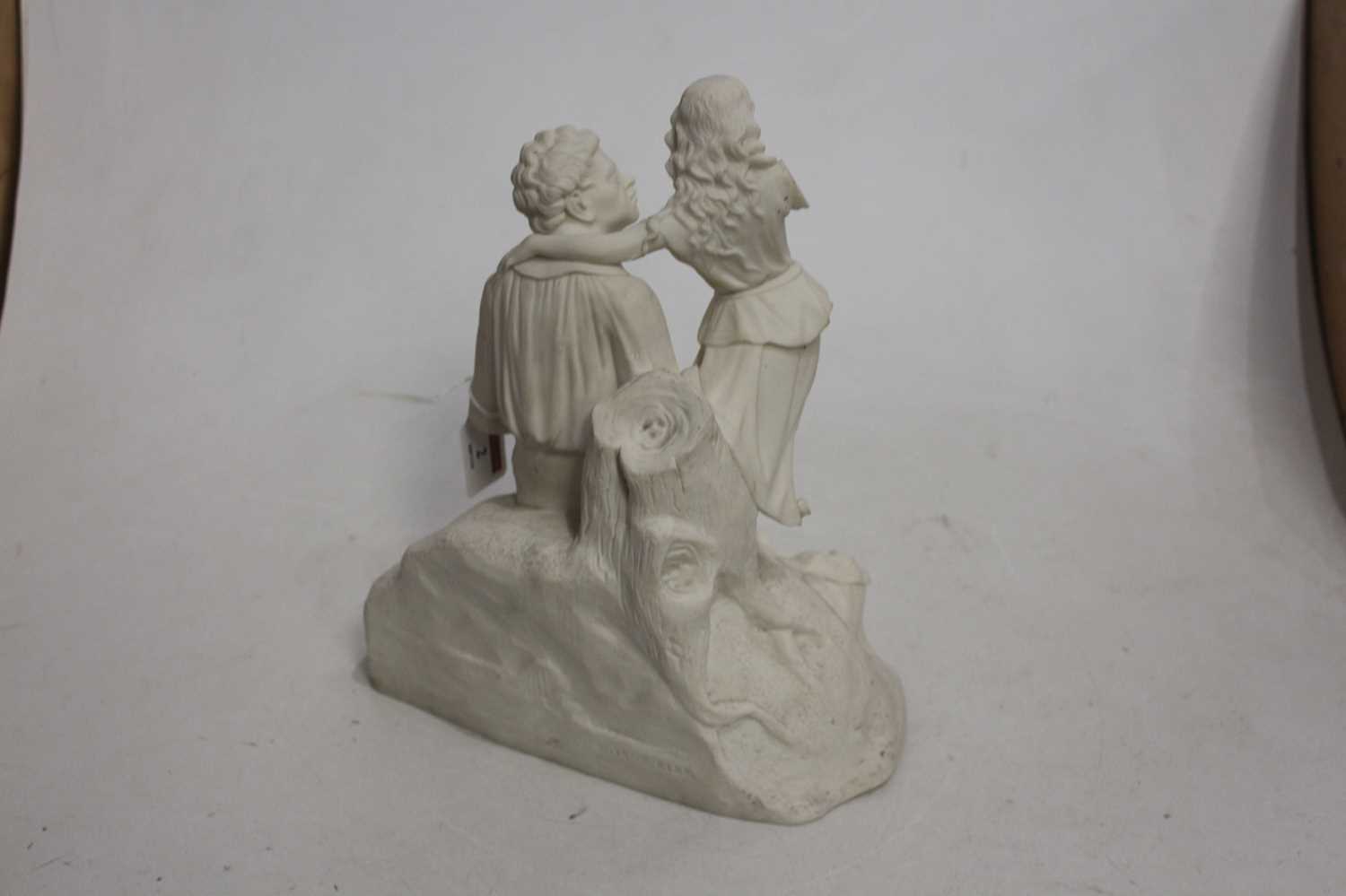 A Parian figure of a seated gentleman, with book in hand and child at his shoulder, on - Image 2 of 3