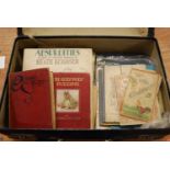 A leather case containing various books to include Fairy Tales of the Brothers Grimm, a New