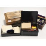 A 20th century black lacquered box, containing various costume jewellery; together with three