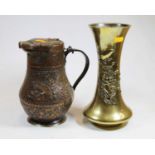 An Oriental relief decorated brass vase, h.26cm; together with a repousee decorated copper jug (2)